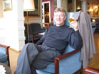 Bill enjoying the parlor and a beer