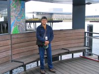 by the harbor, with new Opera House in background